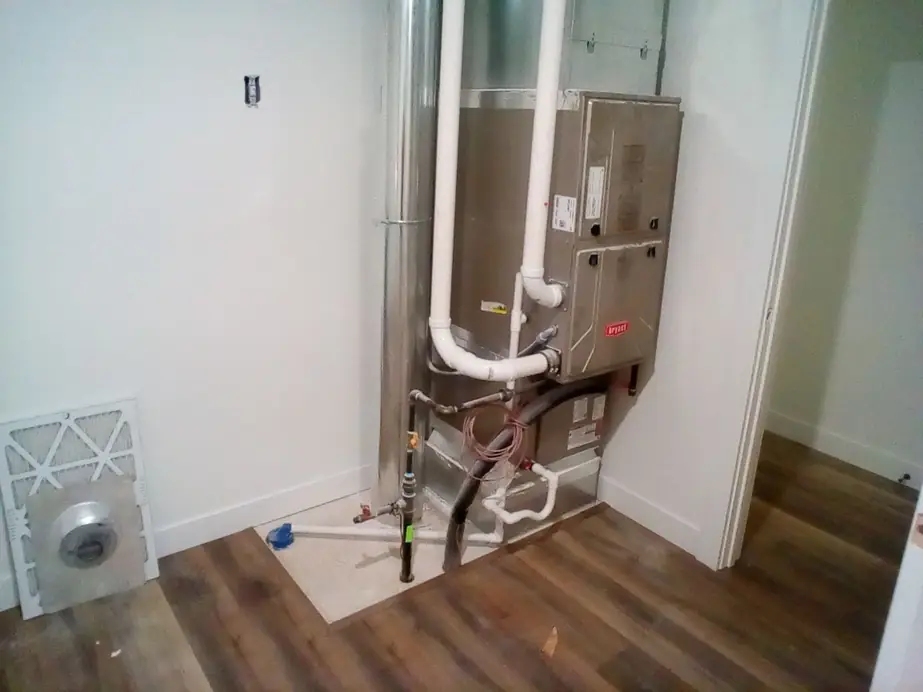 Bryant air handler installed in a hall closet with new piping
